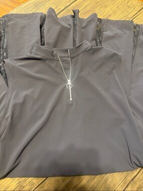 Nike Dri-FIT  dark colored sport dress with lace back and pleats.